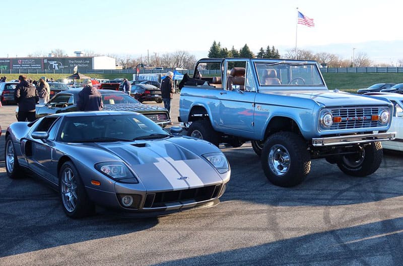 Grey Mustang GT and blue vintage Bronco